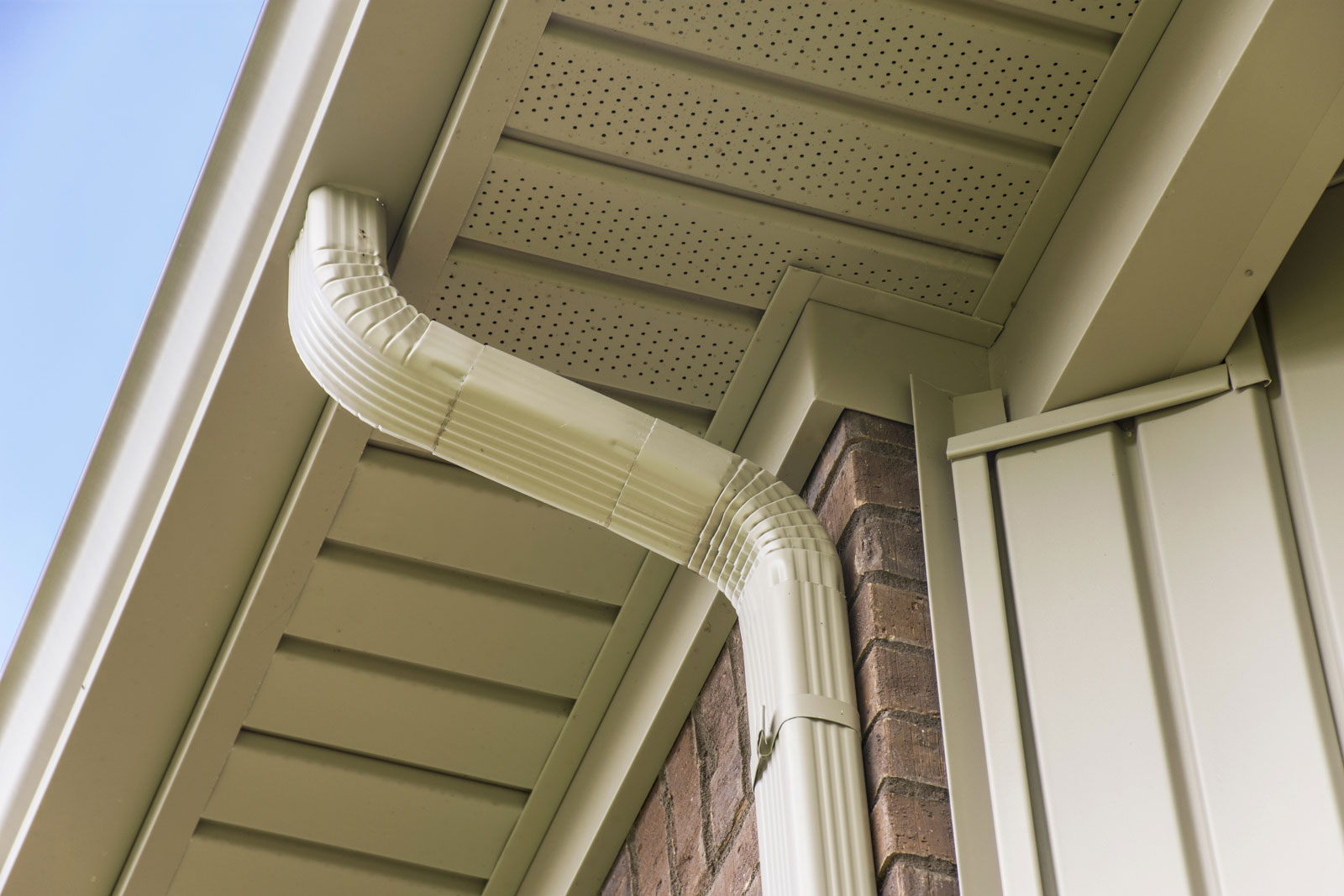 Close up view of gutters on brick building